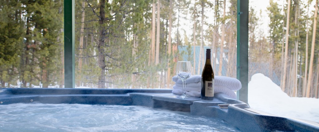 Private hot tub with a view to the surrounding pines ... your seat in the hot tub awaits