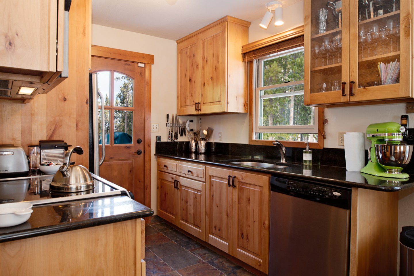 Newly equipped kitchen full of quality bench top appliances and kitchenware