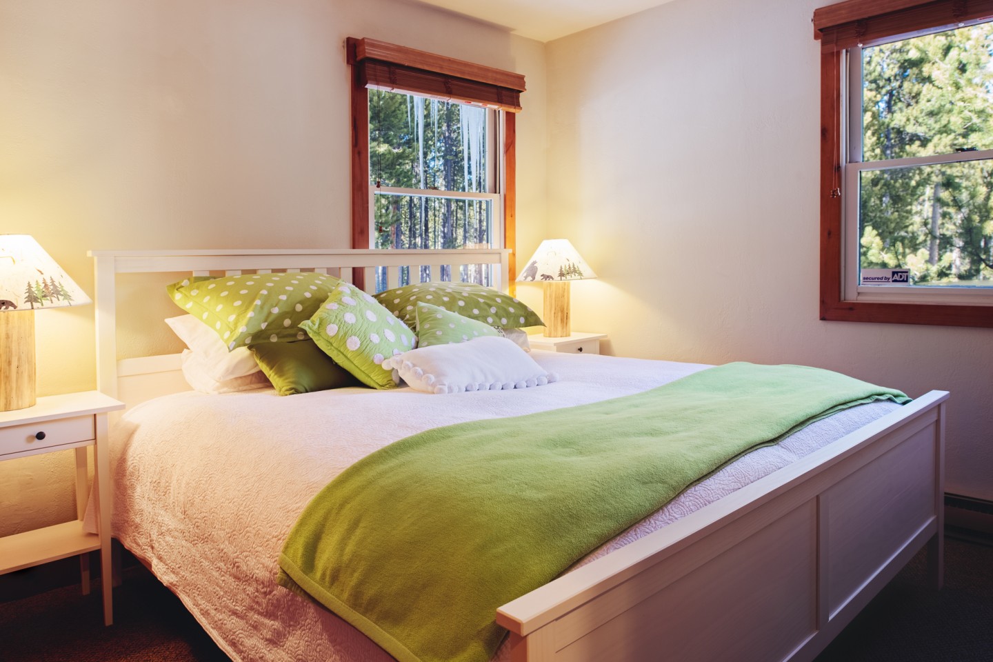 Main floor bedroom — a new King bed with a Sealy Posturepedic pillow top mattress, feather bed, feather duvet, and luxury bed linen